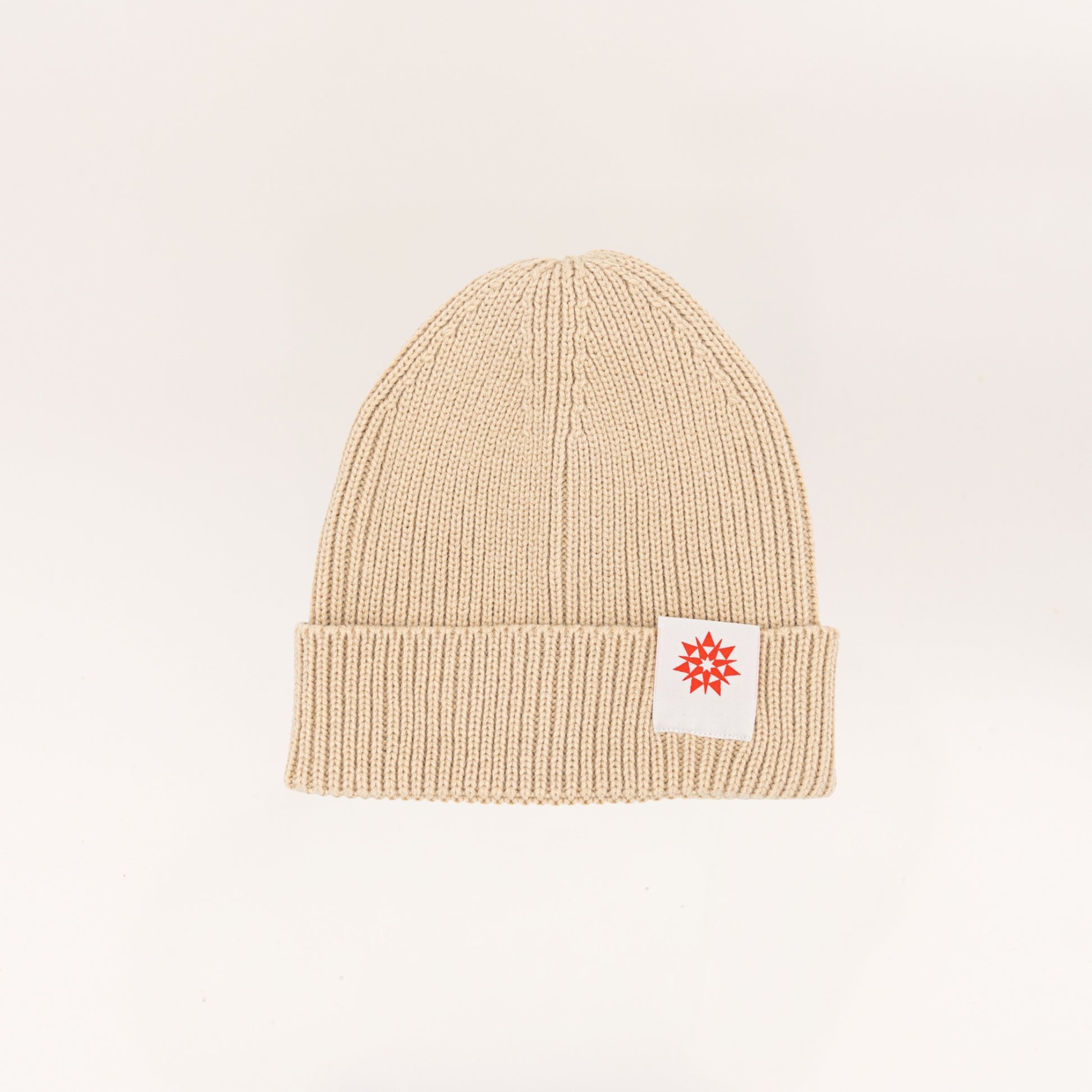 Light beige knit recycled cuffed beanie with Higher grounds Logo patch 