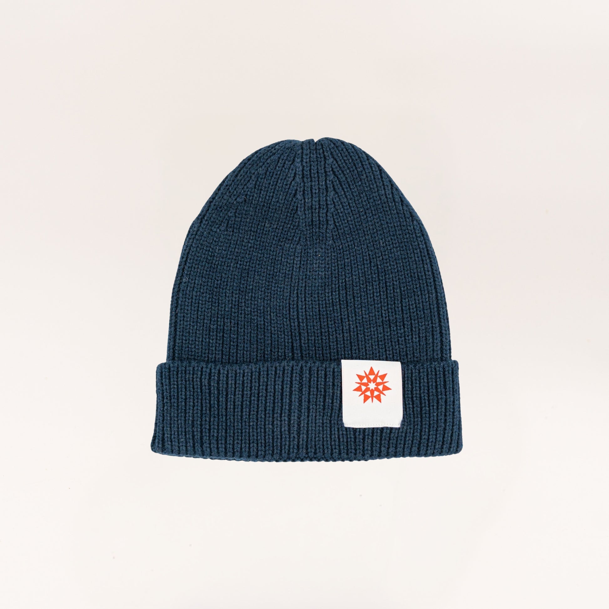 Navy knit recycled cuffed beanie with Higher grounds Logo patch 